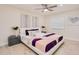 Bright bedroom boasts a ceiling fan, natural light, and elegant decor at 4745 Dixie Dr, Ponce Inlet, FL 32127