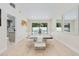Stylish dining area featuring contemporary furnishings and clear sightlines to an adjacent kitchen and outdoor views at 4745 Dixie Dr, Ponce Inlet, FL 32127