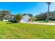 Beautiful home featuring a large lawn, brick driveway, and well-maintained landscaping at 4745 Dixie Dr, Ponce Inlet, FL 32127