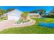 Charming brick home featuring a two-car garage and a meticulously maintained front yard with beautiful landscaping at 4745 Dixie Dr, Ponce Inlet, FL 32127