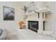 Close-up view of the cozy fireplace with decorative pillows and tasteful artwork at 4745 Dixie Dr, Ponce Inlet, FL 32127