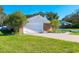 This property includes a two-car garage with brick exterior and landscaped surroundings at 4745 Dixie Dr, Ponce Inlet, FL 32127
