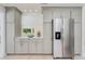A modern kitchen featuring stainless steel appliances and grey cabinets at 4745 Dixie Dr, Ponce Inlet, FL 32127