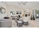 Living room with vaulted ceilings, a white brick fireplace, and access to the backyard at 4745 Dixie Dr, Ponce Inlet, FL 32127