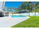 Inviting backyard pool with a spacious deck and lush green lawn, ideal for summer fun at 4745 Dixie Dr, Ponce Inlet, FL 32127