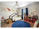 Bright bedroom with fun decor, a play area, and a house frame bed for  at 4836 Ne 26Th Ter, Ocala, FL 34479
