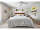 Cozy main bedroom with a ceiling fan, carpet, and decorative wall art at 4836 Ne 26Th Ter, Ocala, FL 34479