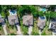 Aerial view of a well-maintained home featuring a lush green lawn and mature landscaping at 4901 Lake Milly Dr, Orlando, FL 32839