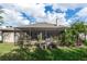 Screened-in back porch and fenced yard offering a serene outdoor space for entertainment and relaxation at 4901 Lake Milly Dr, Orlando, FL 32839