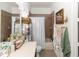 Functional bathroom with a shower-tub combo, decorative accents, and ample storage at 4901 Lake Milly Dr, Orlando, FL 32839