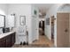 Bathroom features a single vanity, linen closet, shower, and view to bedroom at 4901 Lake Milly Dr, Orlando, FL 32839