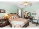 Cozy bedroom with decorative bedding, dark wood furniture, and warm lighting at 4901 Lake Milly Dr, Orlando, FL 32839