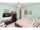 Inviting bedroom with a soft green walls and cozy design elements at 4901 Lake Milly Dr, Orlando, FL 32839