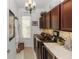 Well-equipped laundry room with modern appliances, custom cabinetry, and stylish countertop at 4901 Lake Milly Dr, Orlando, FL 32839