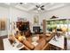 Open living room featuring a fireplace, tray ceiling, and sliding doors to the patio at 4901 Lake Milly Dr, Orlando, FL 32839