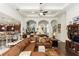 Spacious living room showcasing an open floor plan and elegant architectural details and dark wood floors at 4901 Lake Milly Dr, Orlando, FL 32839