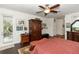 Serene main bedroom with a large window, hardwood floors, and plenty of closet space at 4901 Lake Milly Dr, Orlando, FL 32839