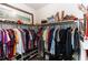 Walk-in closet offering ample storage with organized shelving and hanging space at 4901 Lake Milly Dr, Orlando, FL 32839