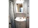 Bathroom vanity area with sink, mirror, neutral toned backsplash, and a decorative shower curtain at 503 5Th Ave, Daytona Beach, FL 32118