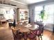 Dining room featuring wood table and chairs, window with plant and hutch at 503 5Th Ave, Daytona Beach, FL 32118