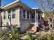 Charming home exterior with front porch, swing and brick steps at 503 5Th Ave, Daytona Beach, FL 32118
