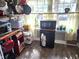 Compact kitchen area featuring modern microwave and natural light from windows at 503 5Th Ave, Daytona Beach, FL 32118