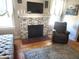 Living Room featuring fireplace, wood floors, large area rug and furniture at 503 5Th Ave, Daytona Beach, FL 32118