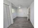 Bedroom featuring wood-look floors, white door, a window and ceiling fan at 508 N Keech St, Daytona Beach, FL 32114