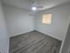 Bedroom with a ceiling fan, a window and wood-look floors at 508 N Keech St, Daytona Beach, FL 32114