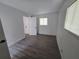 Bright bedroom features wood-look flooring and ample natural light from the window at 508 N Keech St, Daytona Beach, FL 32114