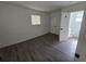 Neutral bedroom showcases vinyl floors and access to a nearby bathroom at 508 N Keech St, Daytona Beach, FL 32114