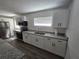 Renovated kitchen featuring stainless appliances and granite countertops at 508 N Keech St, Daytona Beach, FL 32114