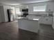Modern kitchen boasts stainless steel appliances and a stylish island at 508 N Keech St, Daytona Beach, FL 32114