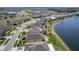 A neighborhood aerial view of waterfront homes featuring screened patios and a tranquil streetscape at 5298 Bear Corn Run, Port Orange, FL 32128