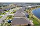 An aerial view showcases waterfront homes with screened patios and neighborhood streetscape at 5298 Bear Corn Run, Port Orange, FL 32128