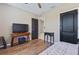 Bedroom showcasing wood floors, neutral decor, and a well-lit space at 5298 Bear Corn Run, Port Orange, FL 32128