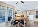 Dining area showing wood floors and an open layout perfect for entertaining at 5298 Bear Corn Run, Port Orange, FL 32128