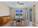 Bright dining area with wood floors and natural light overlooking backyard at 5298 Bear Corn Run, Port Orange, FL 32128