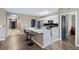 Kitchen with quartz countertops, stainless appliances, and a functional island with seating at 5298 Bear Corn Run, Port Orange, FL 32128