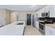 Modern kitchen with stainless steel appliances and a central island for dining and meal prep at 5298 Bear Corn Run, Port Orange, FL 32128