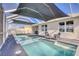 Inviting outdoor pool with a screened enclosure, ideal for relaxation and enjoyment in a private setting at 5298 Bear Corn Run, Port Orange, FL 32128