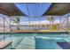Refreshing pool with stunning lake views, featuring a tanning ledge and tranquil ambiance at 5298 Bear Corn Run, Port Orange, FL 32128