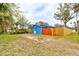 Large backyard featuring a newly constructed wooden fence and a partial view of the house at 600 Holmes Ave, Daytona Beach, FL 32114