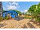 Backyard featuring a seating area, beautiful rocks, and landscaping at 600 Holmes Ave, Daytona Beach, FL 32114
