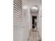 Hallway with tiled floor leading to rooms with great lighting and white walls at 600 Holmes Ave, Daytona Beach, FL 32114