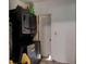 Features a stacked washer and dryer unit, optimizing space in this laundry area with easy access to an adjacent room at 600 Holmes Ave, Daytona Beach, FL 32114