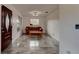 Cozy living room furnished with a leather sofa and wood coffee table, enhanced by new tile floors at 600 Holmes Ave, Daytona Beach, FL 32114
