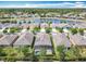 Community aerial view showcasing residences with lake views and a screened-in pool at 669 E Victoria Trails Blvd, Deland, FL 32724