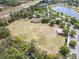 Expansive lot and amenities, complemented by a serene lake view, create a unique community setting at 669 E Victoria Trails Blvd, Deland, FL 32724