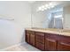 Bathroom with granite countertops, double sink vanity and neutral tiling at 669 E Victoria Trails Blvd, Deland, FL 32724